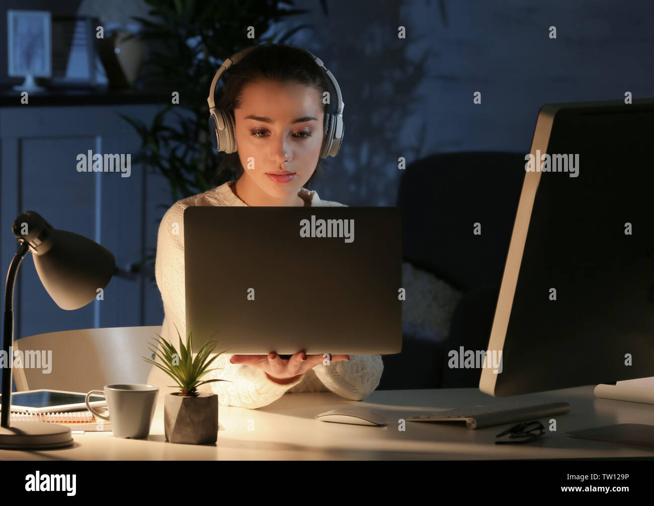 Woman freelancer working night notebook hi-res stock photography and ...