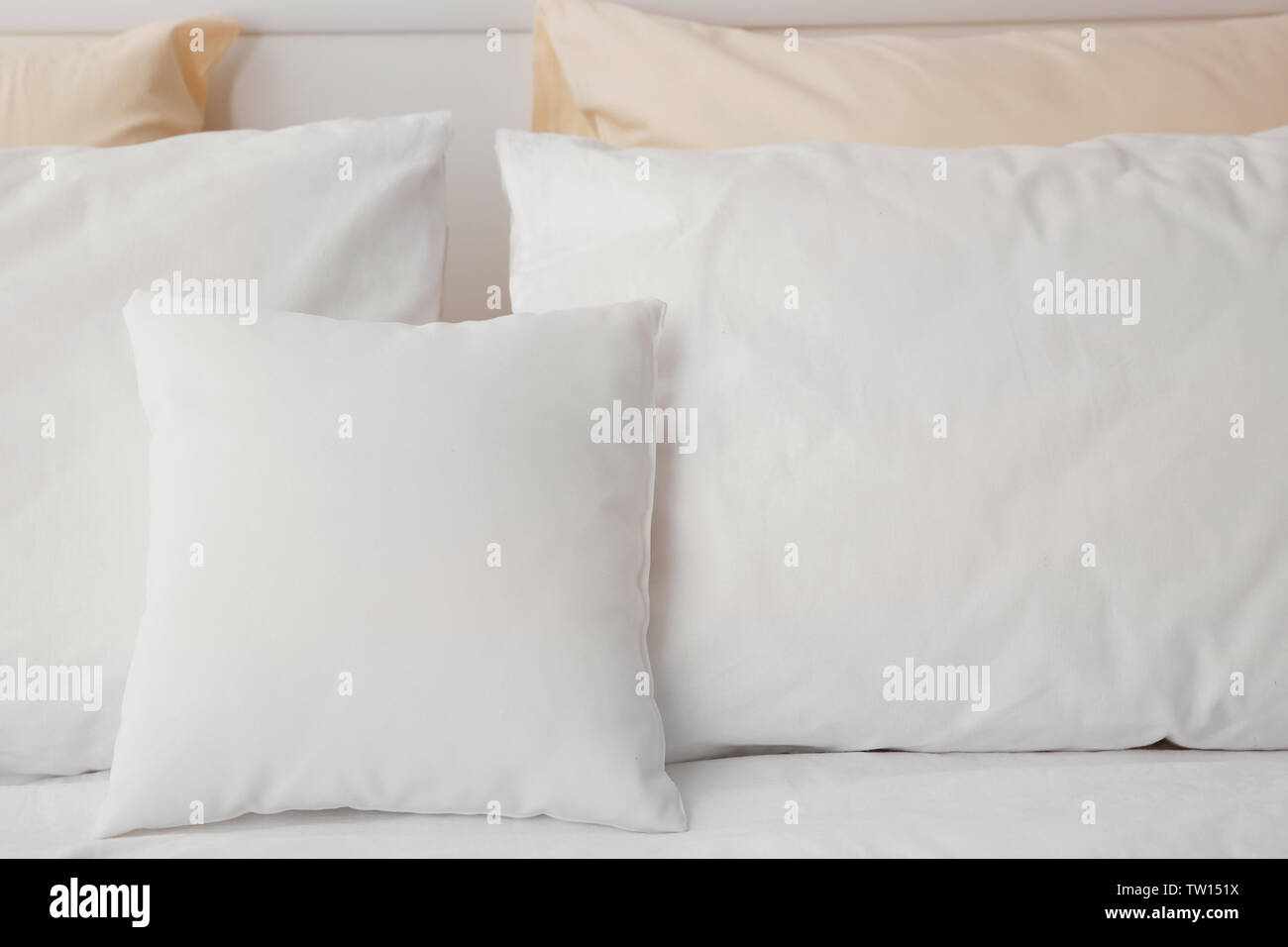 Blank soft pillows on the bed Stock Photo