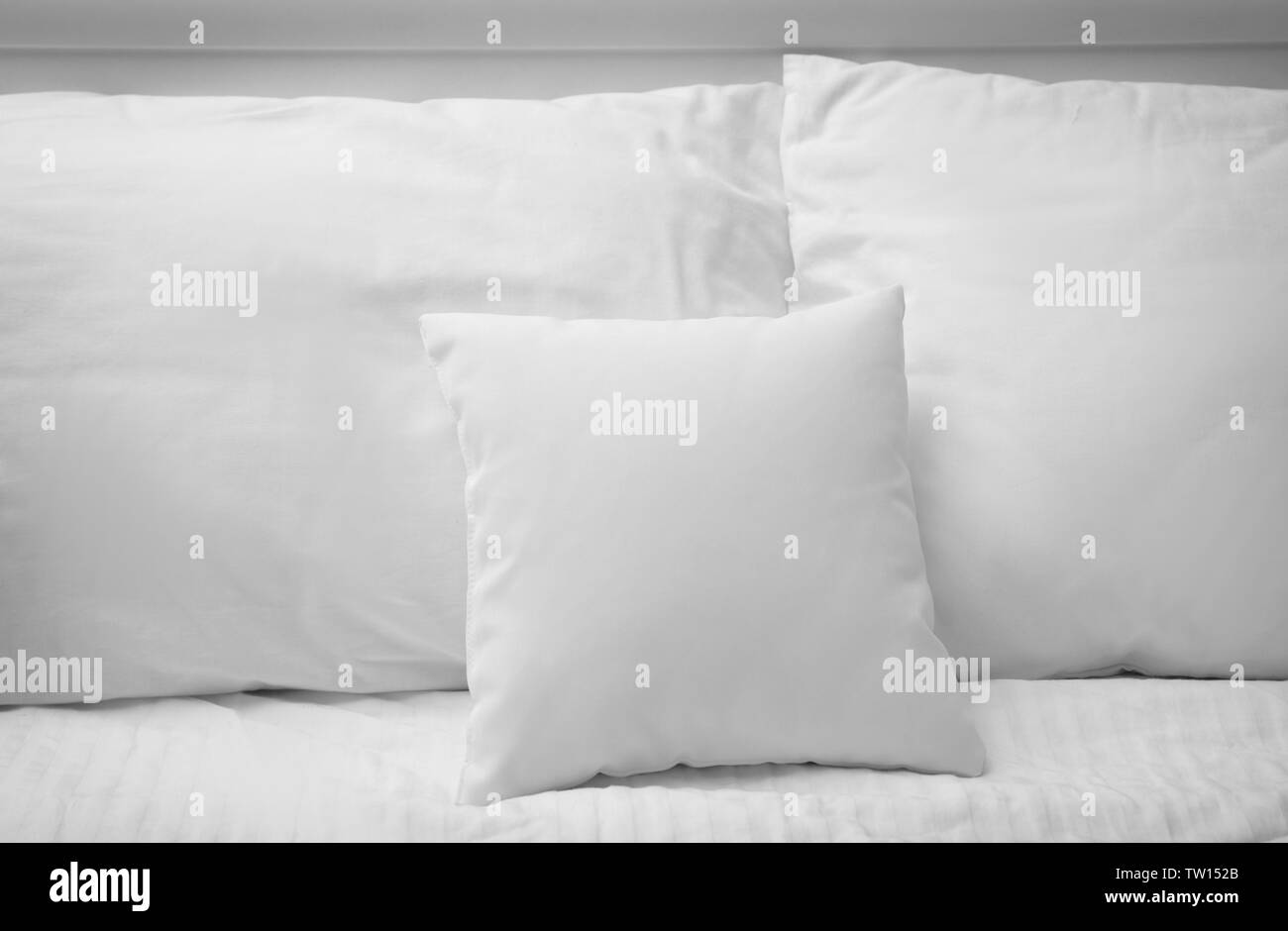 Blank soft pillows on the bed Stock Photo