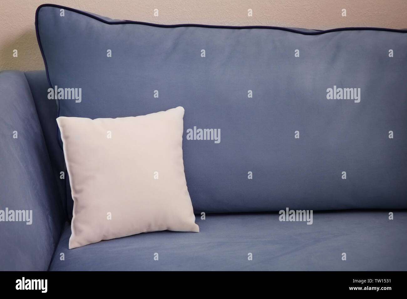 Blank soft pillow on cozy couch Stock Photo