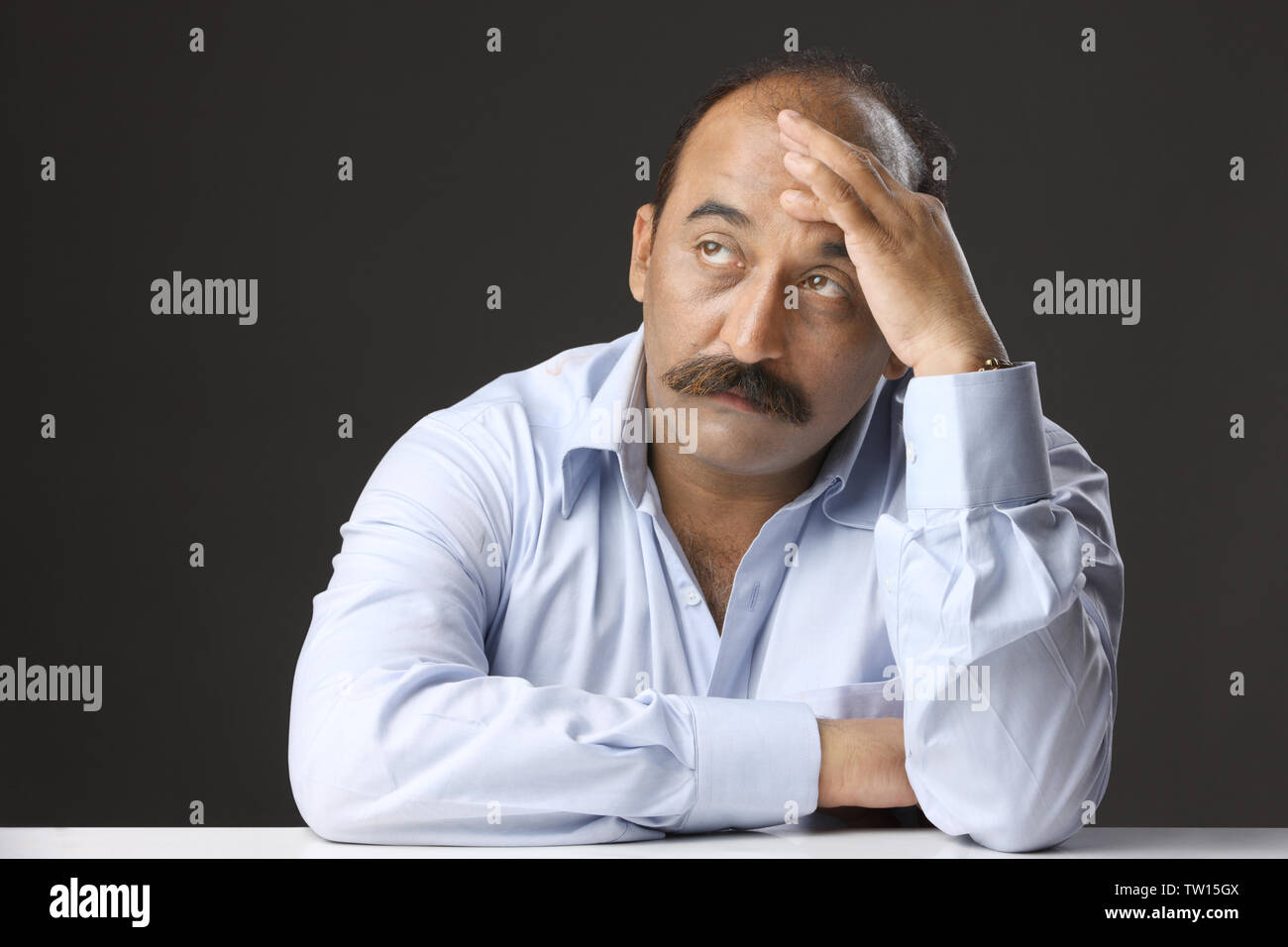 Old man with his head in his hands hi-res stock photography and images -  Alamy