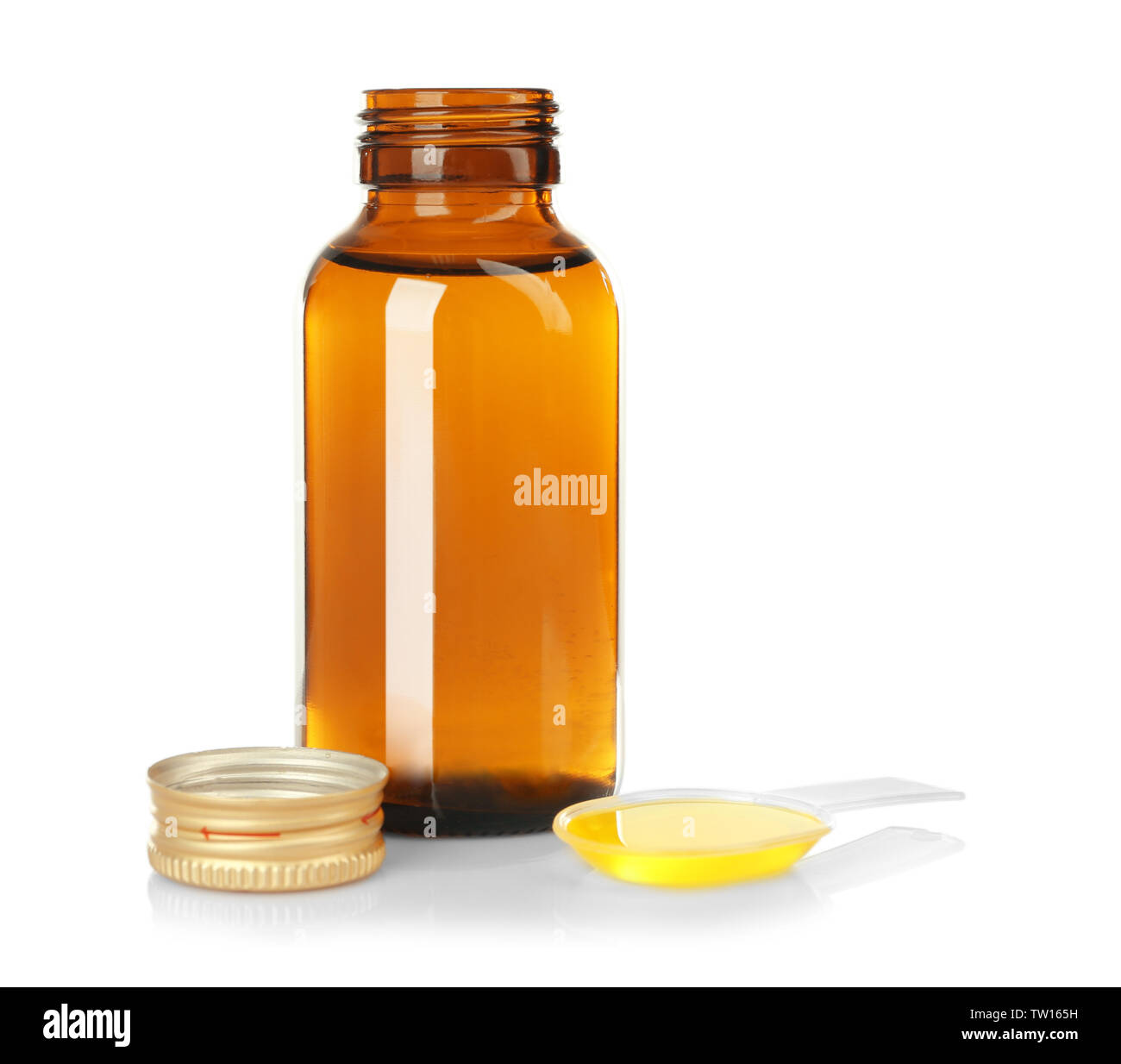 Bottle with cough medicine syrup and poured dose in spoon isolated on