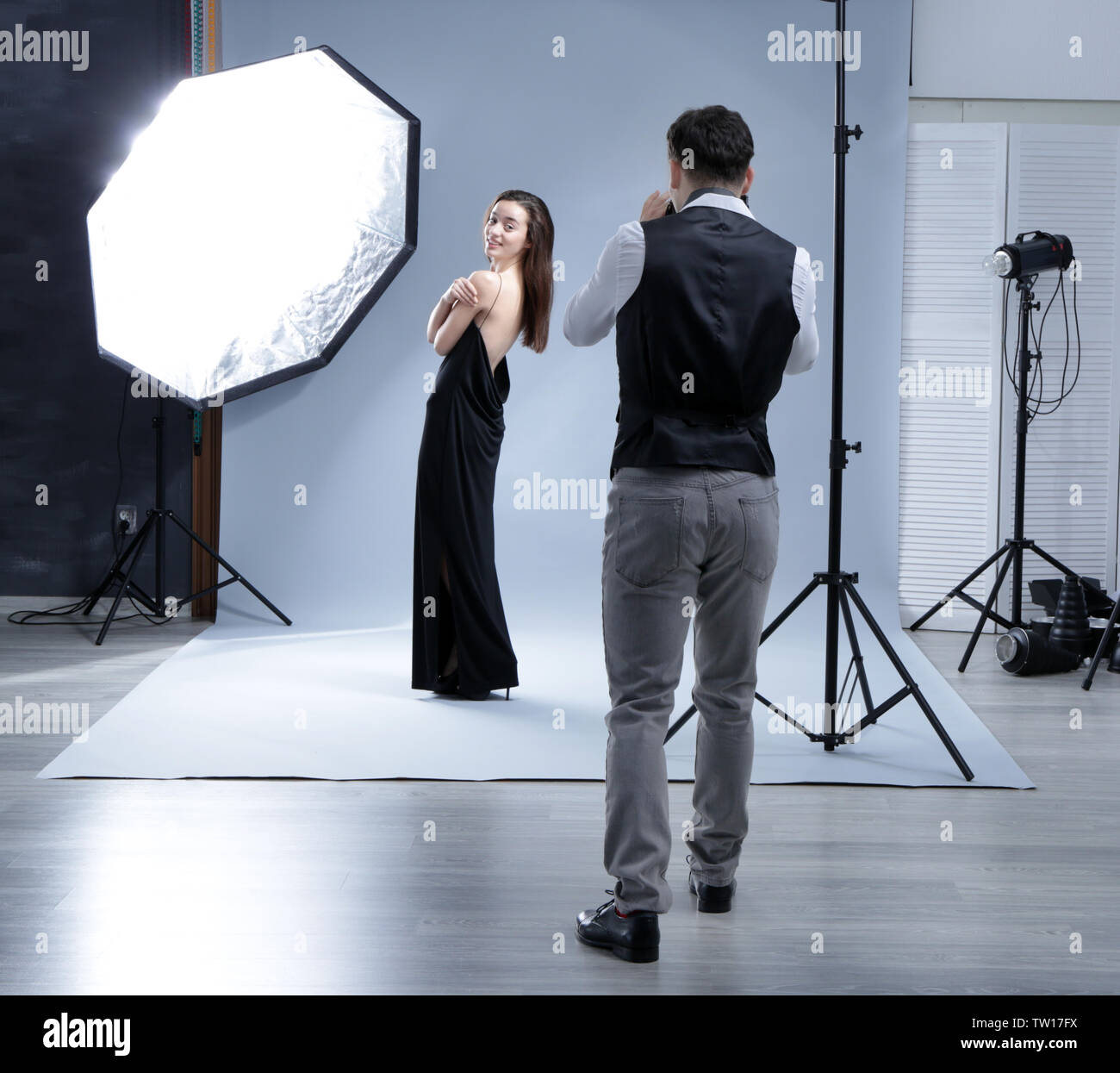 Model posing for professional photographer at studio Stock Photo - Alamy
