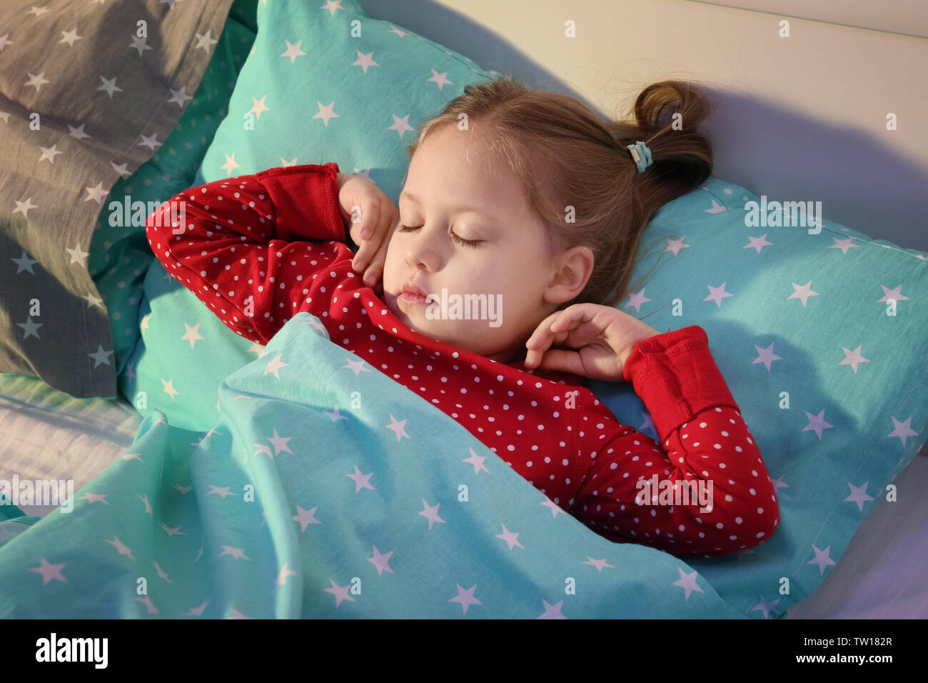 Cute little girl sleeping in bed Stock Photo Alamy