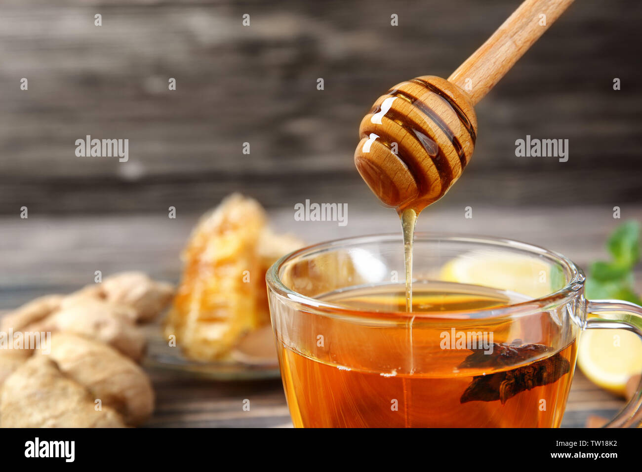 Hot drink with honey for cough remedy, closeup Stock Photo Alamy