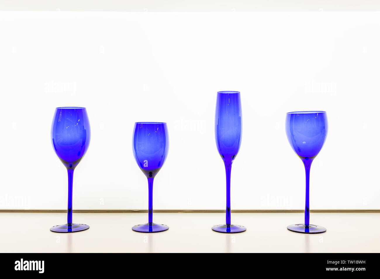 isolated empty blue goblet against white background Stock Photo