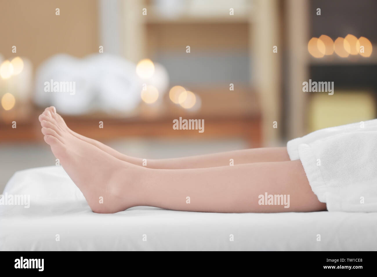 Female legs on massage table in beauty salon Stock Photo Alamy