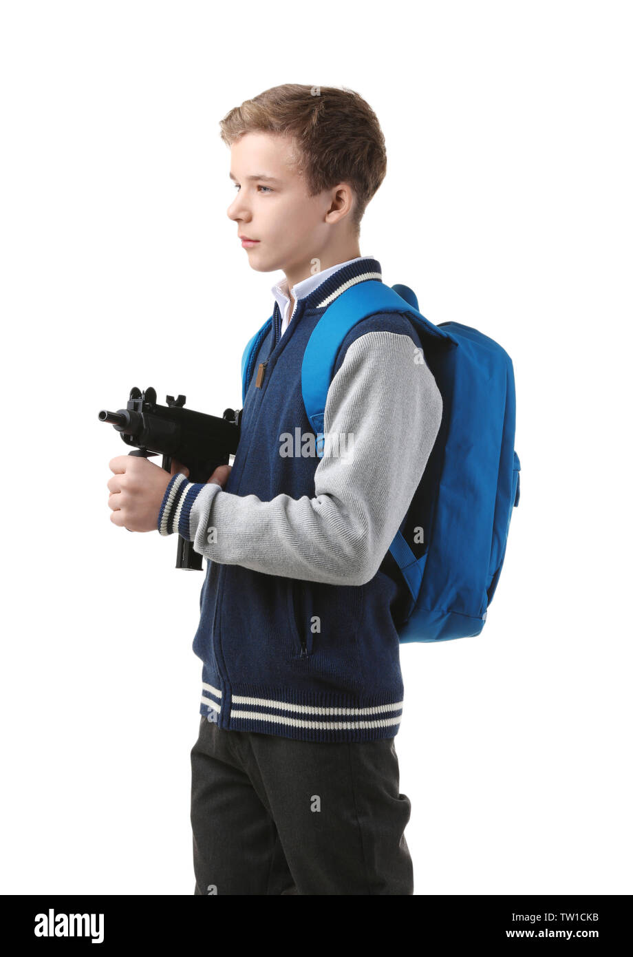 Teenage boy with backpack holding gun on white background Stock Photo -  Alamy