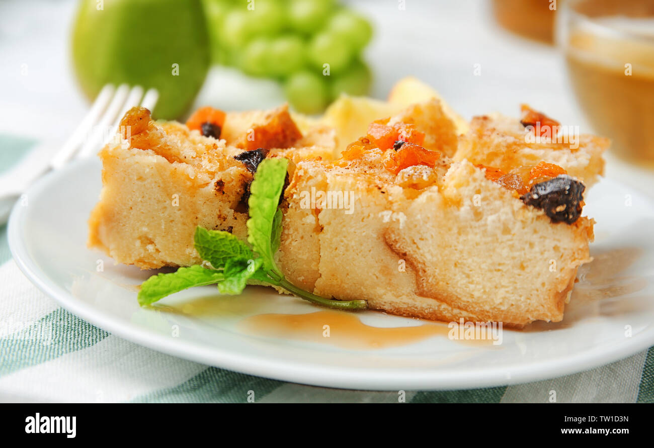 Delicious bread pudding with fruits on plate Stock Photo
