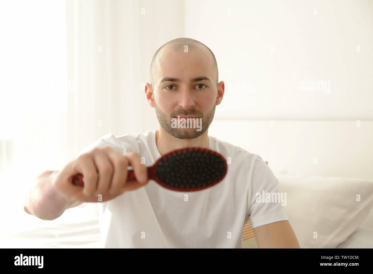 Hair Loss Concept Young Man With Hair Comb Closeup Stock Photo