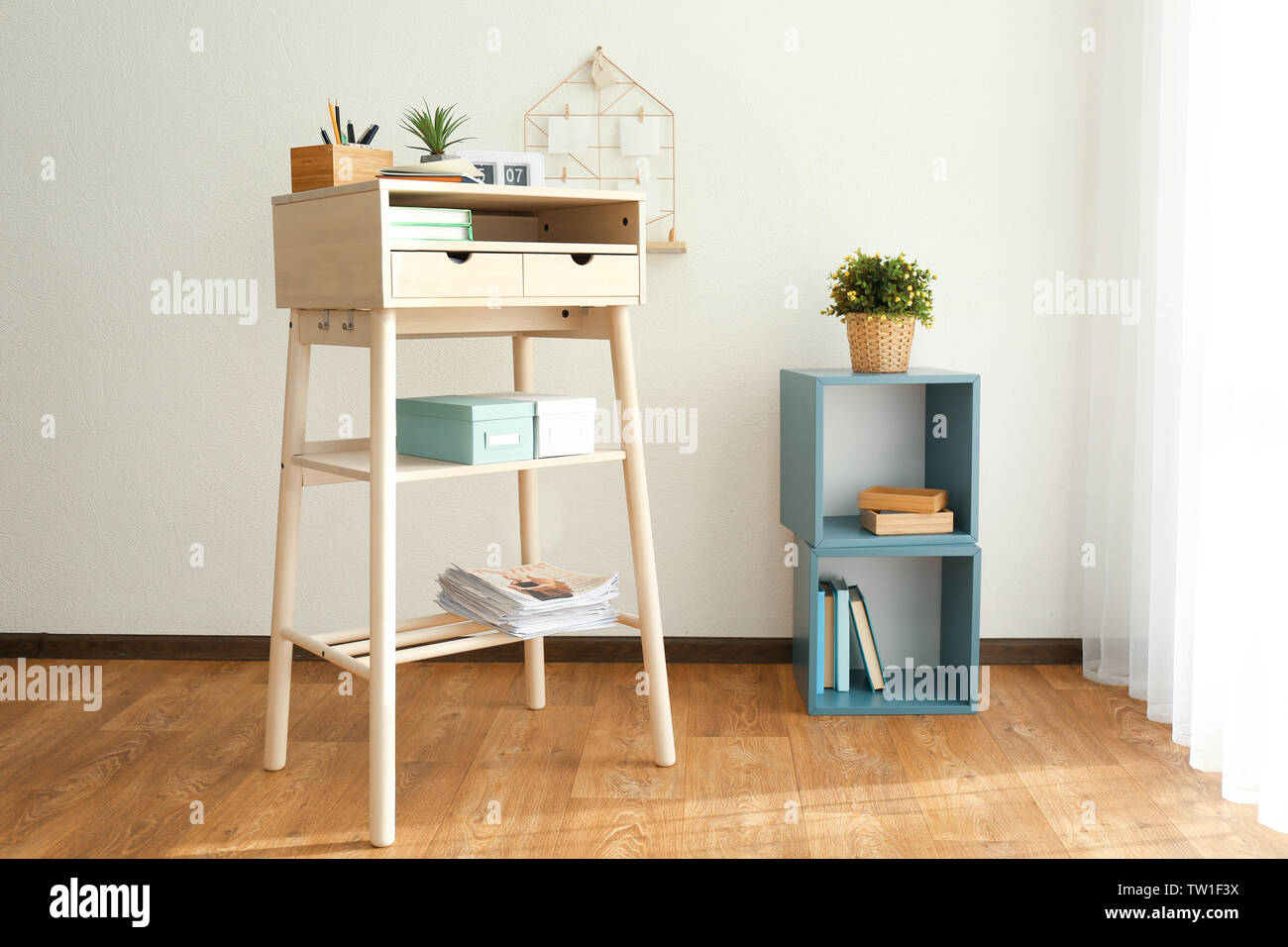 High Wooden Table As Stand Up Work Place In Modern Interior Stock