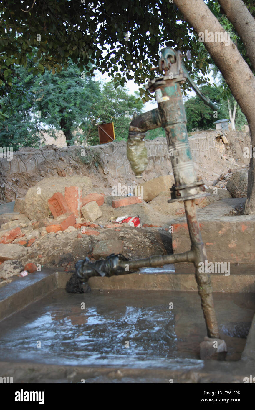 Water pump under the tree, India Stock Photo