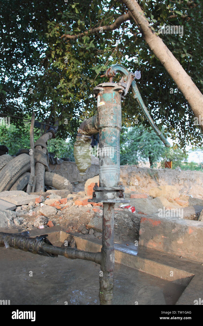 Water pump under the tree, India Stock Photo