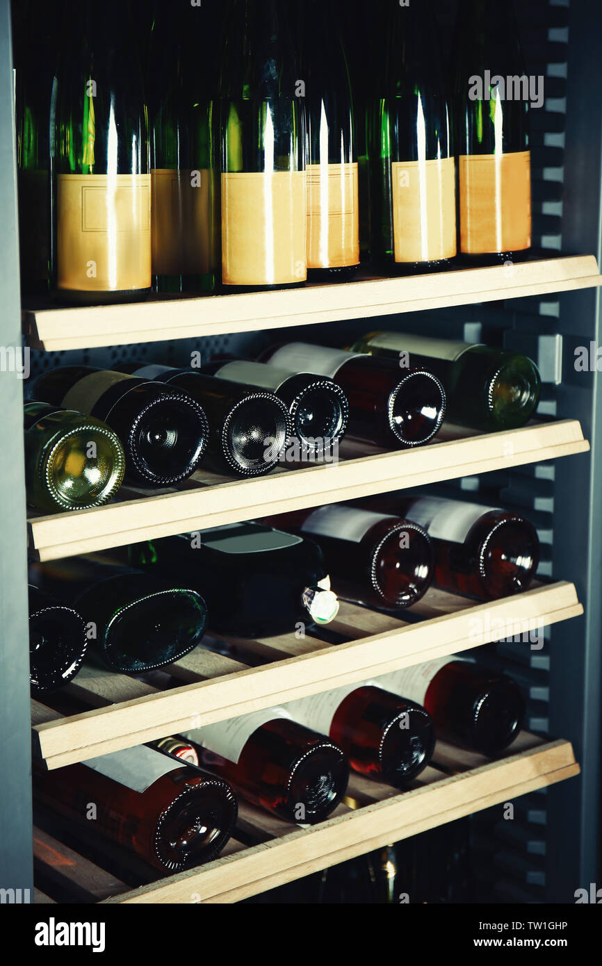 Wine bottles cooling in refrigerator Stock Photo Alamy