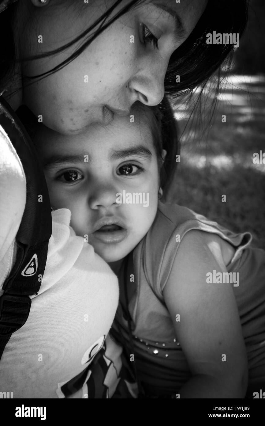 child in her mother arms Stock Photo