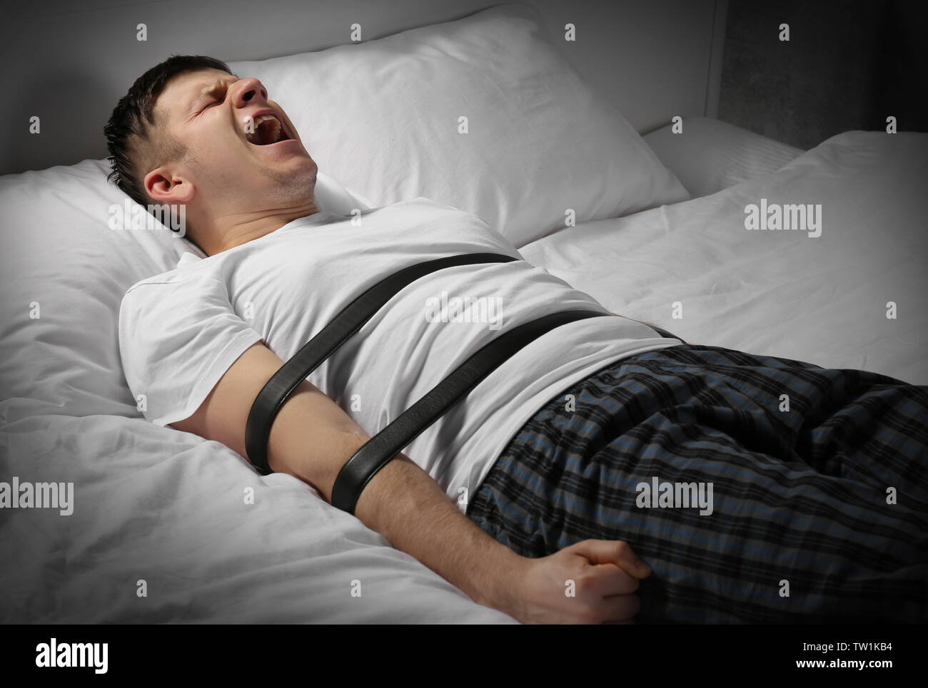 Man tied to bed hires stock photography and images Alamy