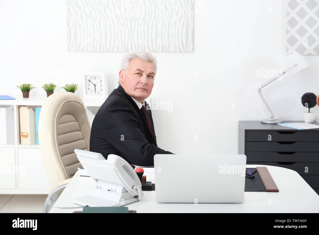 Senior notary public sitting in office Stock Photo Alamy