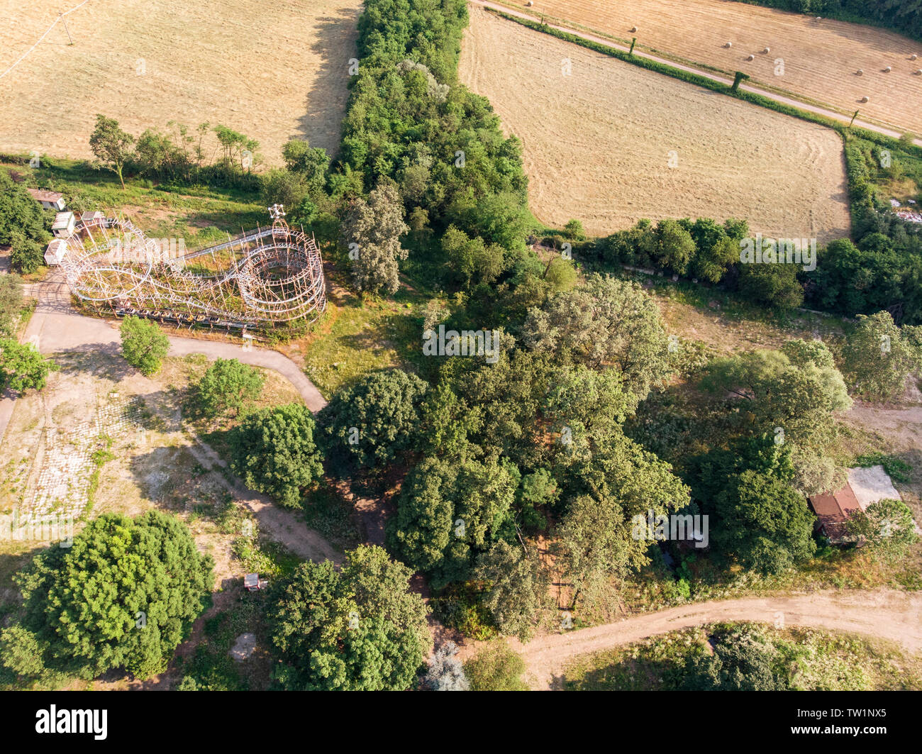 Aerial view of the satellite city (città satellite), Greenland. Playground in disuse. Iron skeleton of roller coaster. Limbiate, Milan, Italy Stock Photo