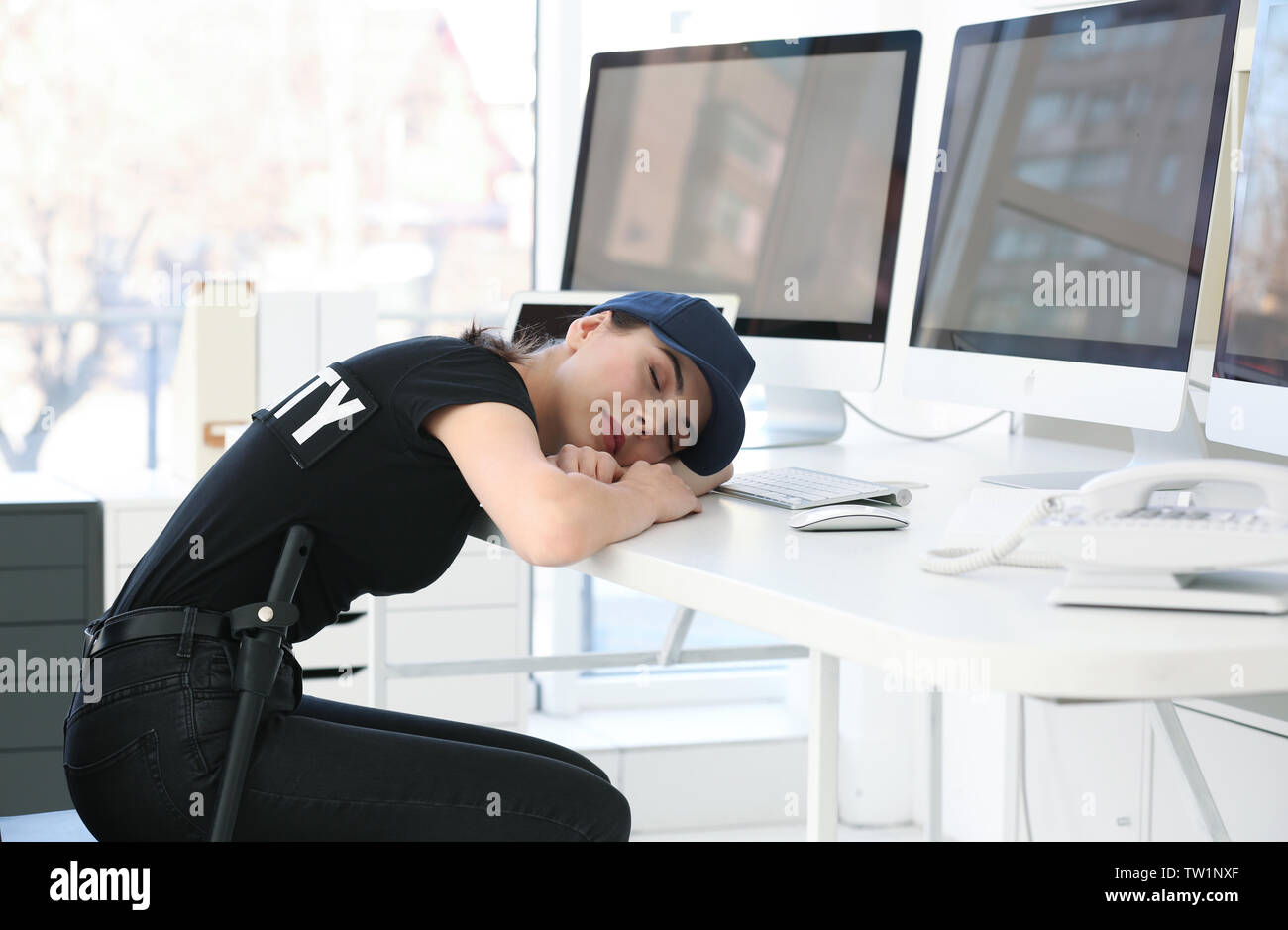 Beautiful security guard sleeping in surveillance room Stock Photo Alamy