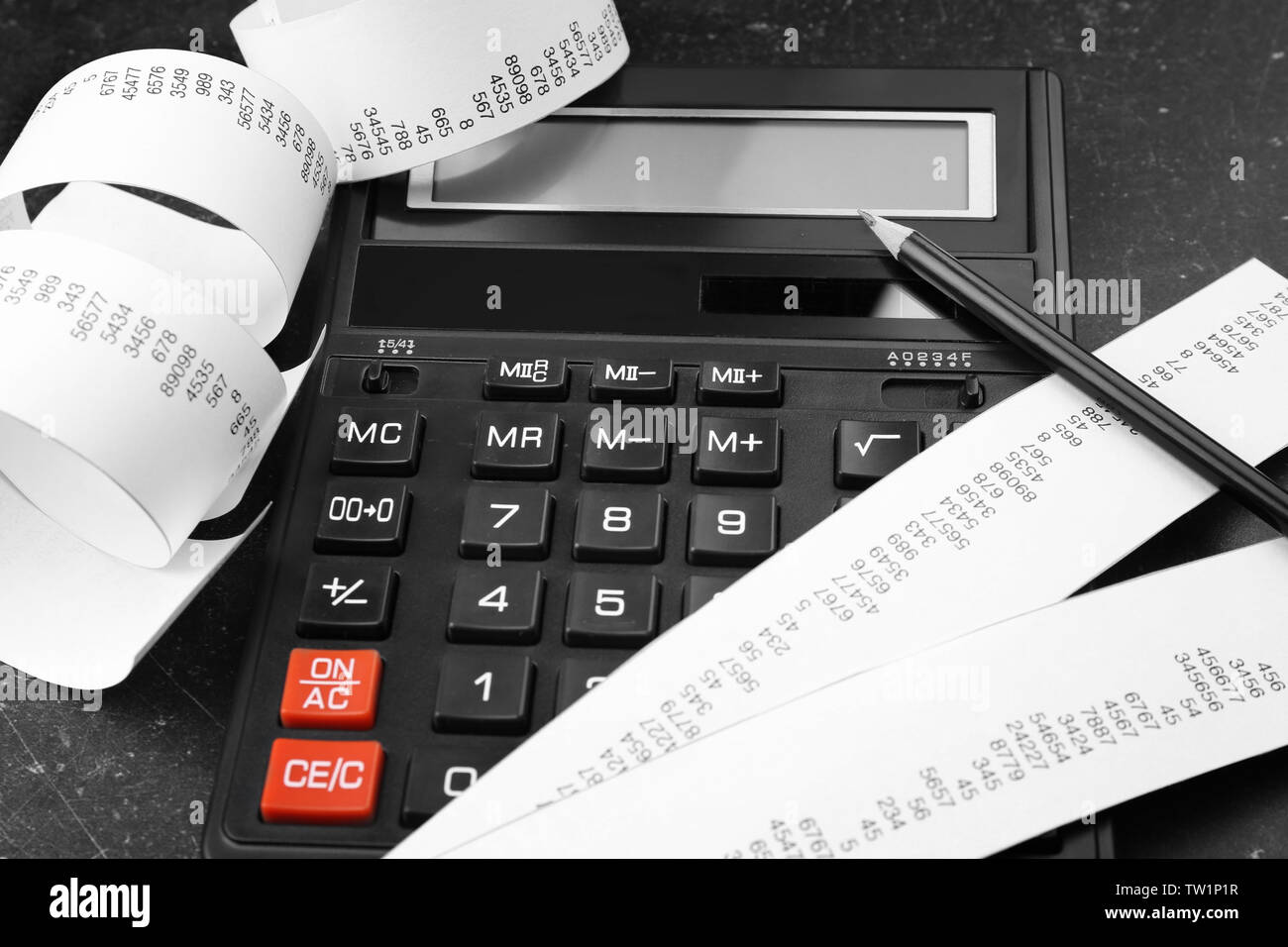 Calculator with adding machine tape, closeup Stock Photo Alamy
