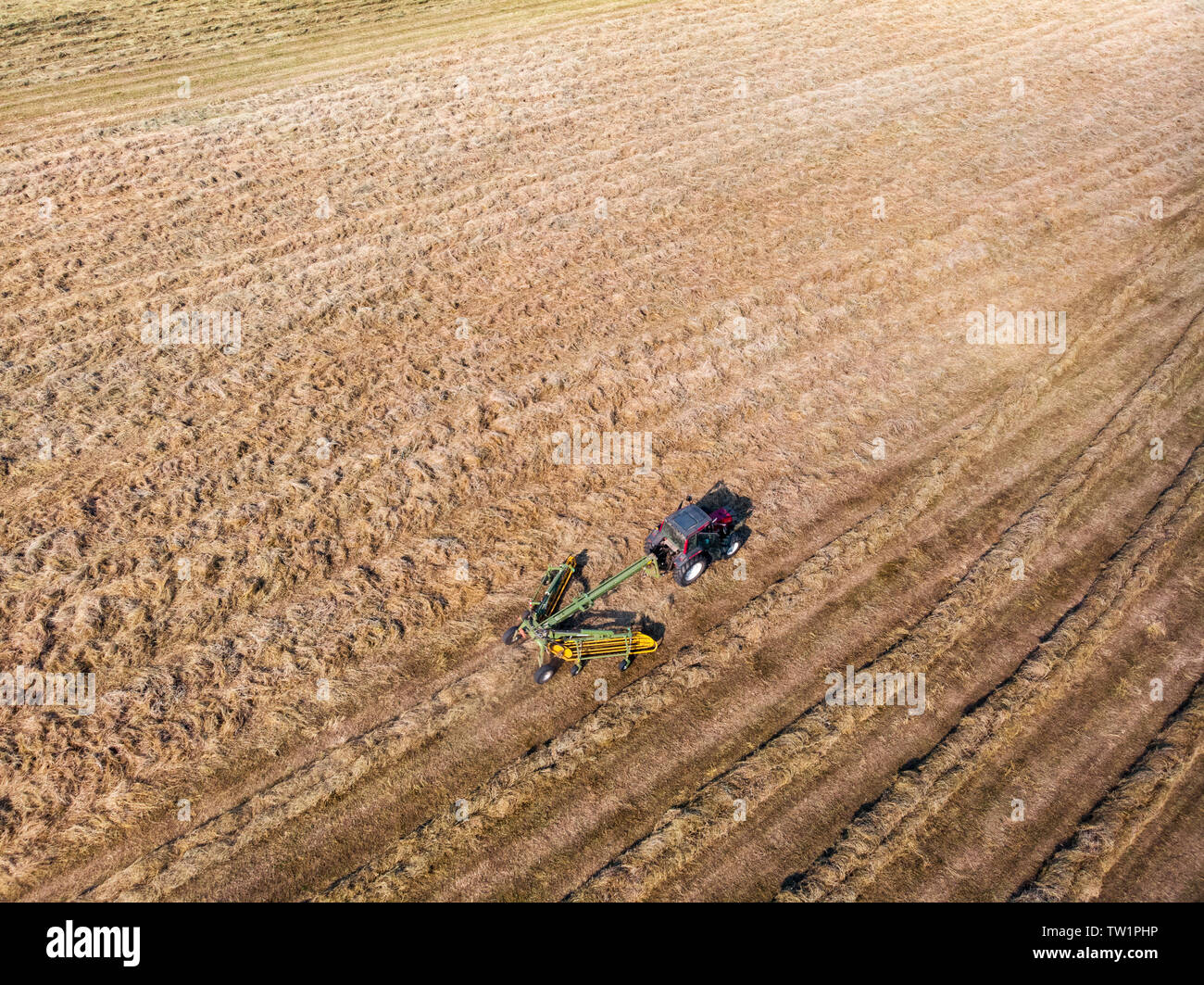 Tractor Raking Fields Nature and landscape, aerial view of fields with tractor with round ...