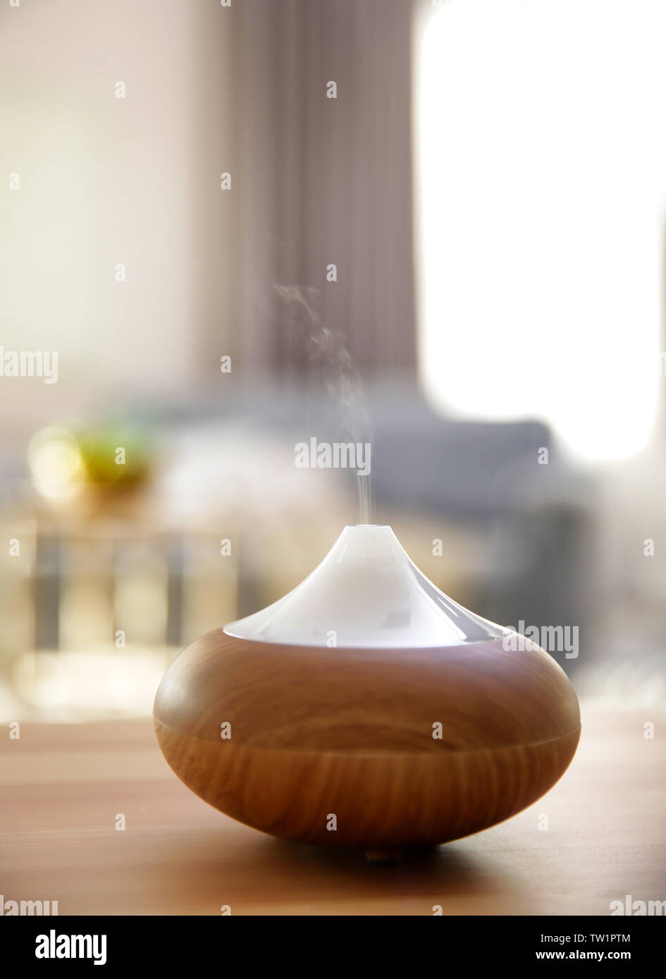 Electric oil diffuser on blurred room background Stock Photo