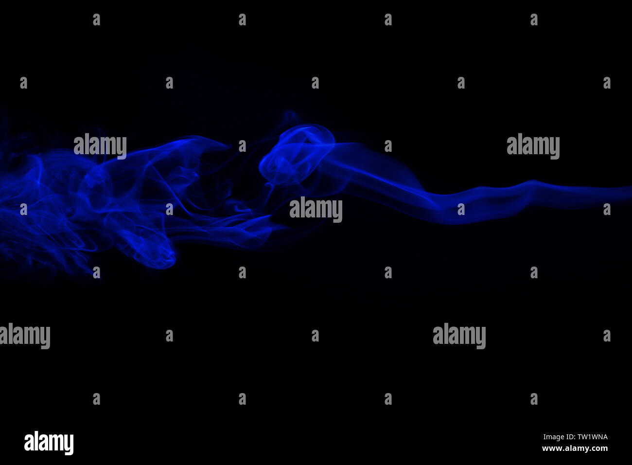 Swirl of blue smoke on black background Stock Photo - Alamy