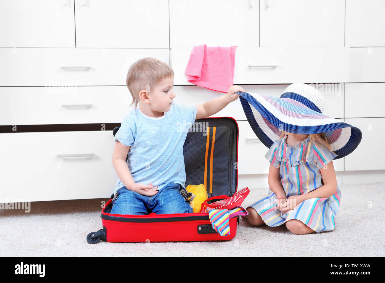 Cute Small Kids Playing In Wardrobe Stock Photo 256354613 Alamy