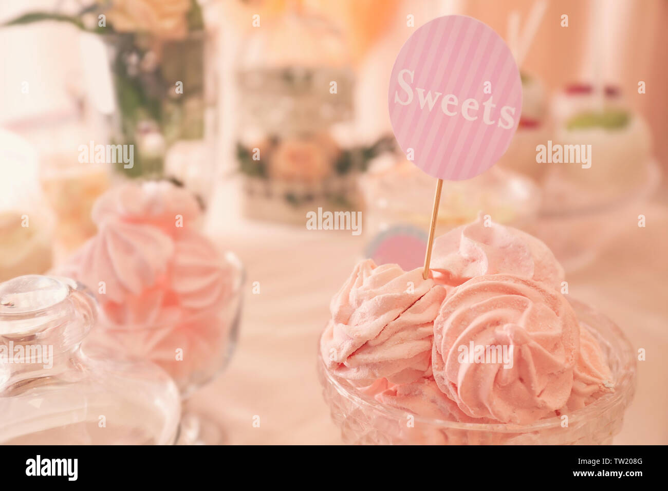 Tasty marshmallows on festive table Stock Photo