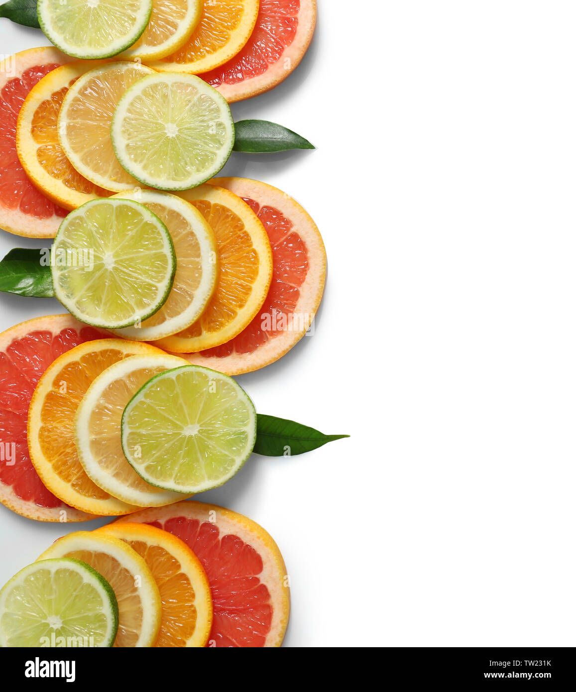 Fresh slices of citrus fruits on white background Stock Photo - Alamy