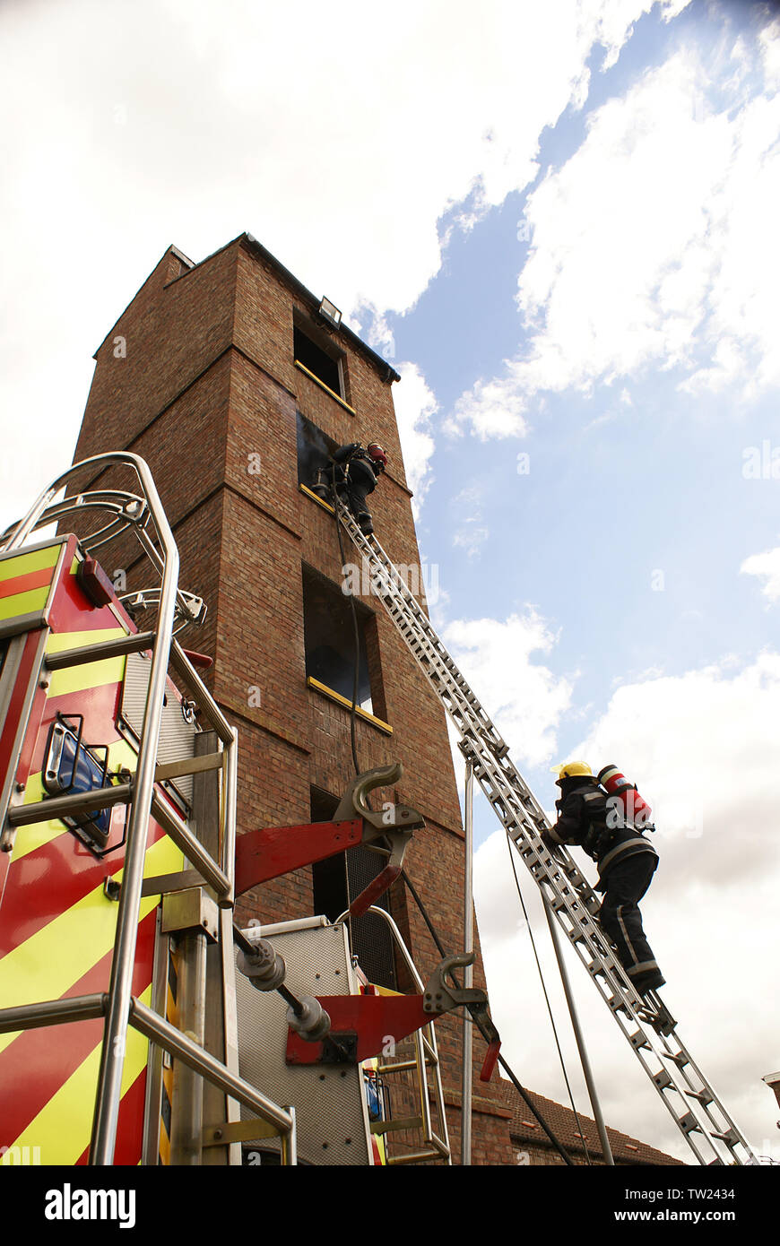 Fire Fighter Climbing 135m Ladder Stock Photo Alamy