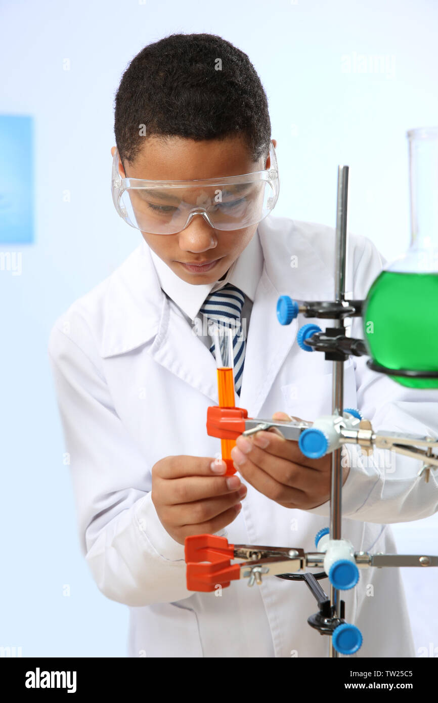 School boy making experiment in chemistry class Stock Photo - Alamy