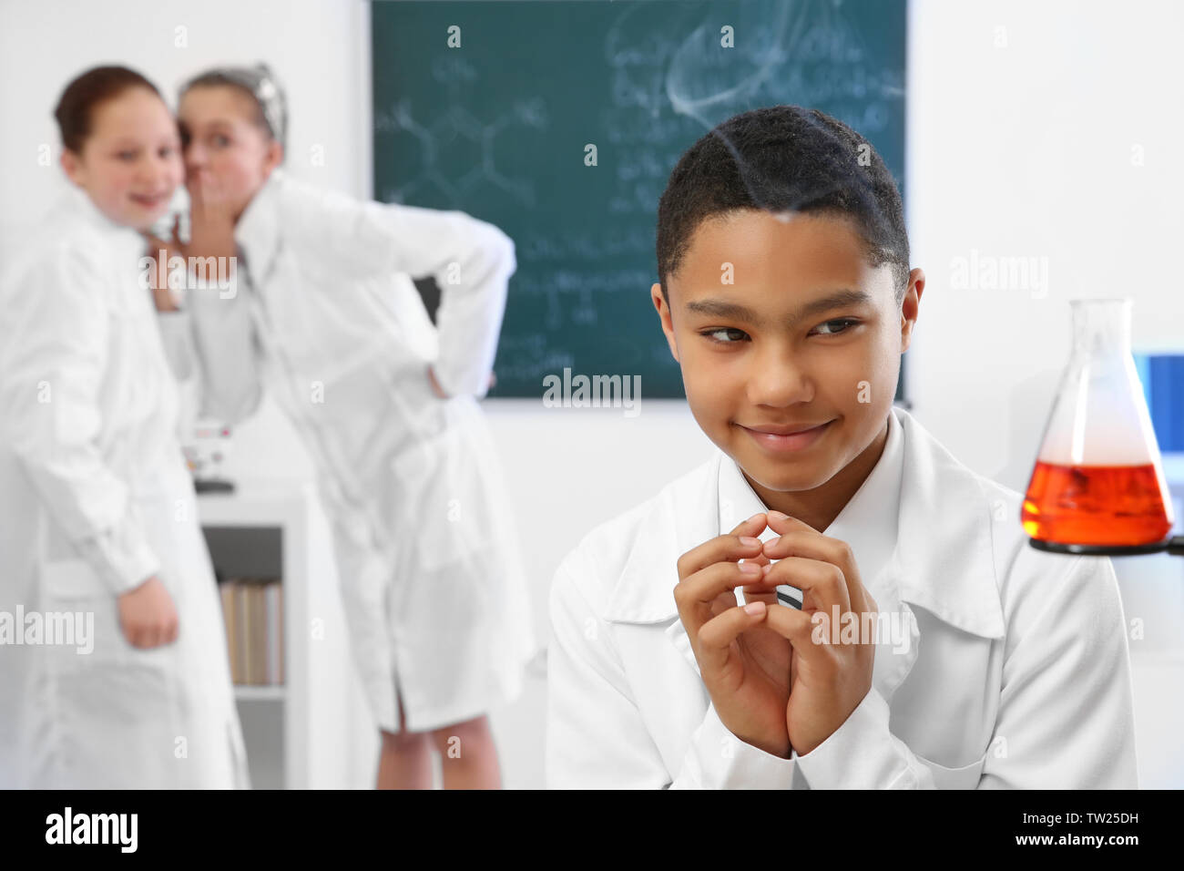 School boy making experiment in chemistry class Stock Photo - Alamy