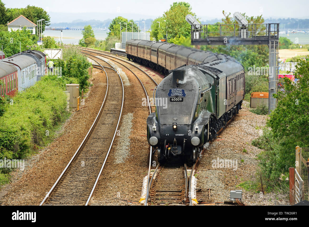 LNER Class A4 Pacific No 60009 'Union of South Africa' leaves the platform loop at Dawlish Warren with the Dartmouth Express to Kingswear, 08.06.2019. Stock Photo