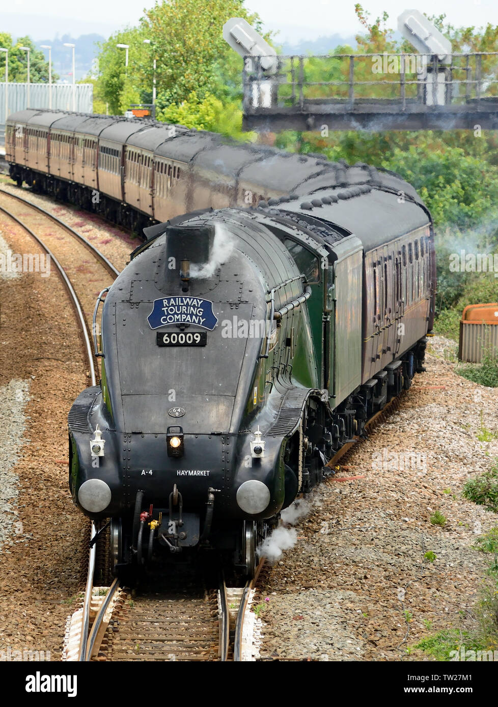 LNER Class A4 Pacific No 60009 'Union of South Africa' leaves the platform loop at Dawlish Warren with the Dartmouth Express to Kingswear, 08.06.2019. Stock Photo