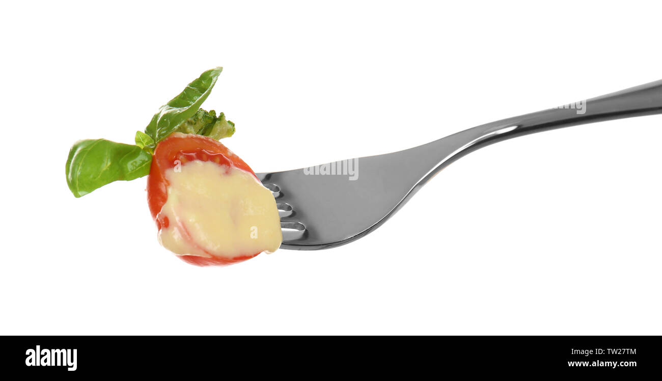 Fork with pinned snack on white background Stock Photo