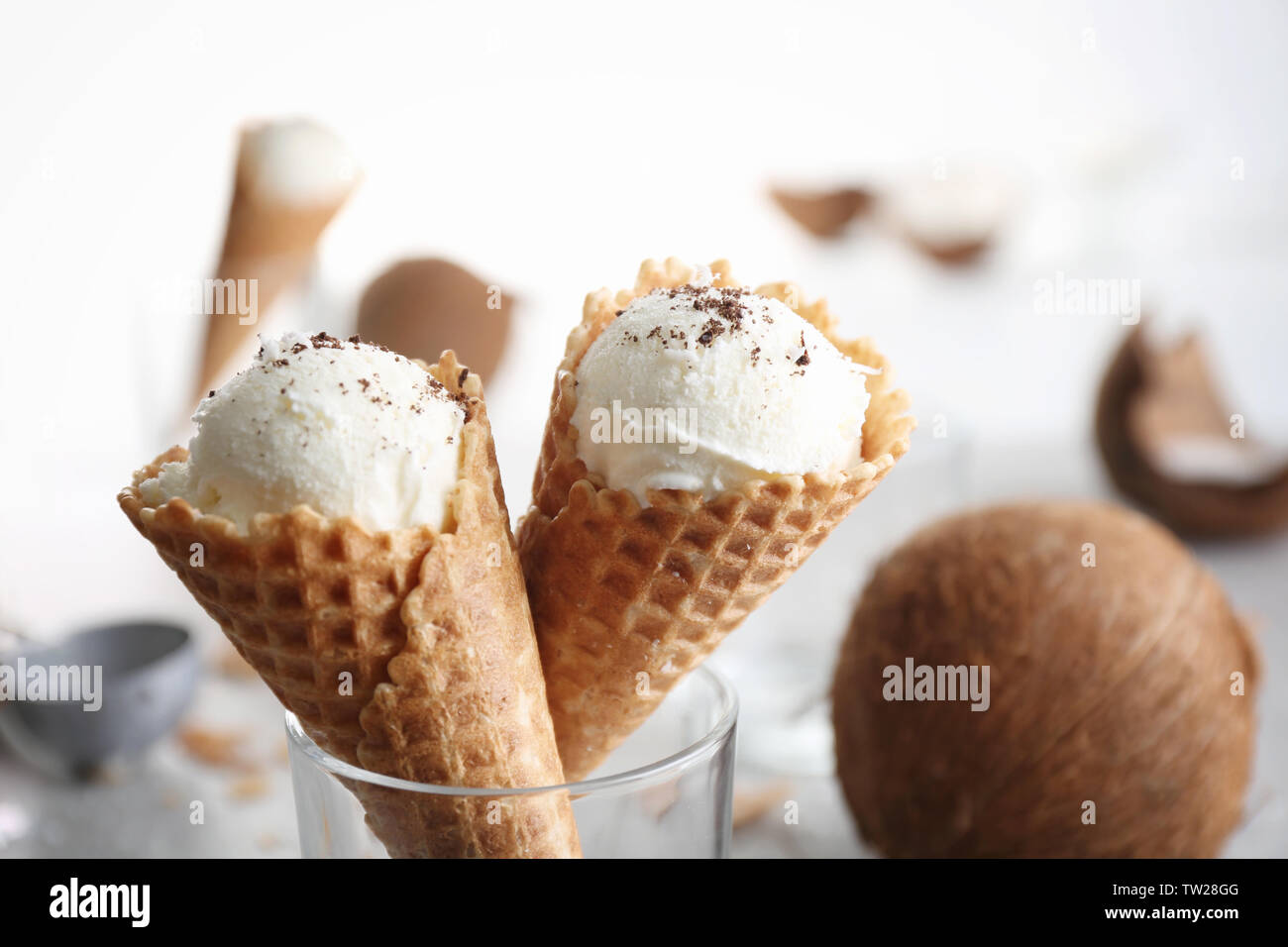 Waffle cones with balls of coconut ice cream in glass, close up Stock Photo