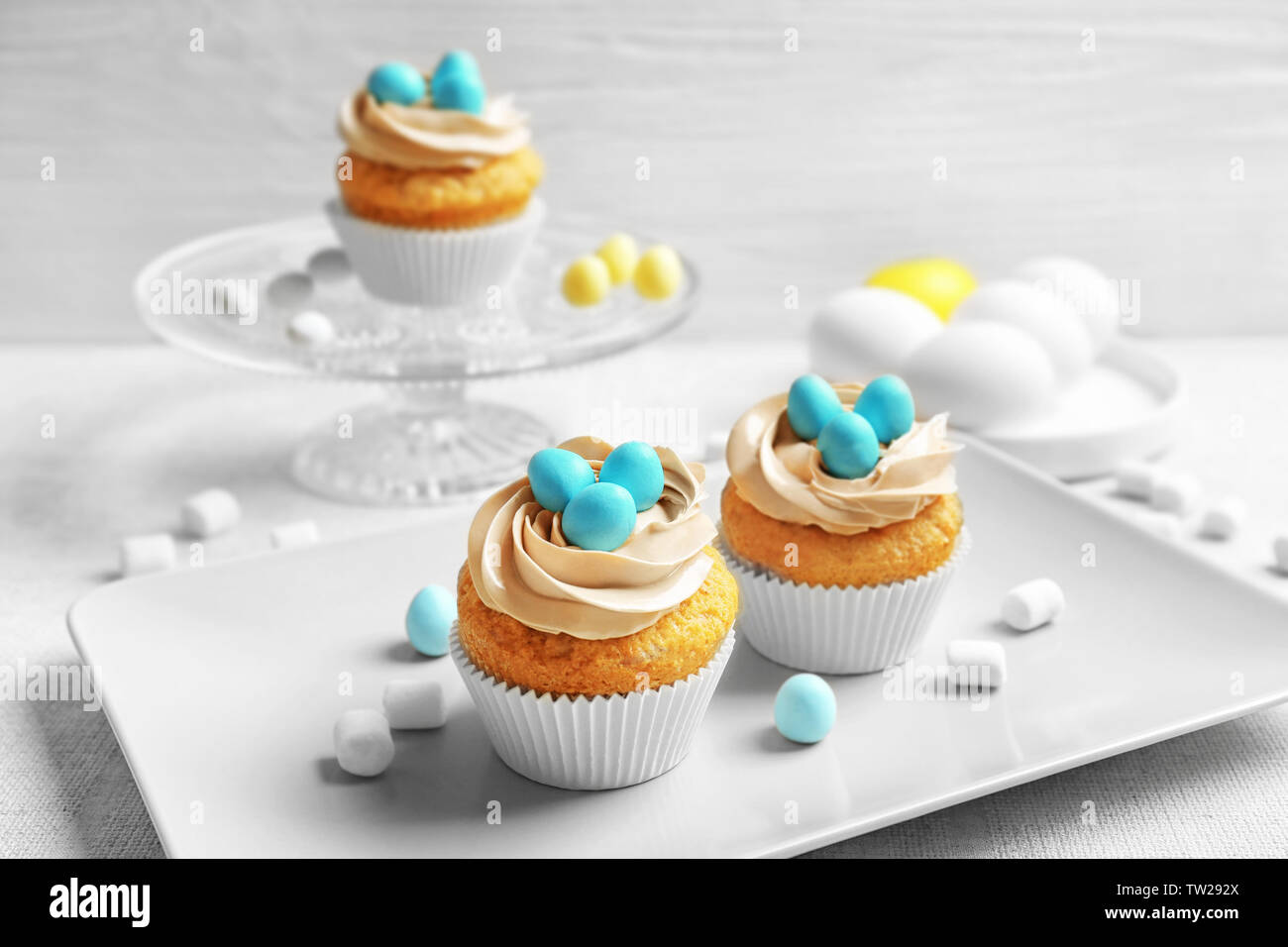 Easter cupcakes on table against grey background Stock Photo