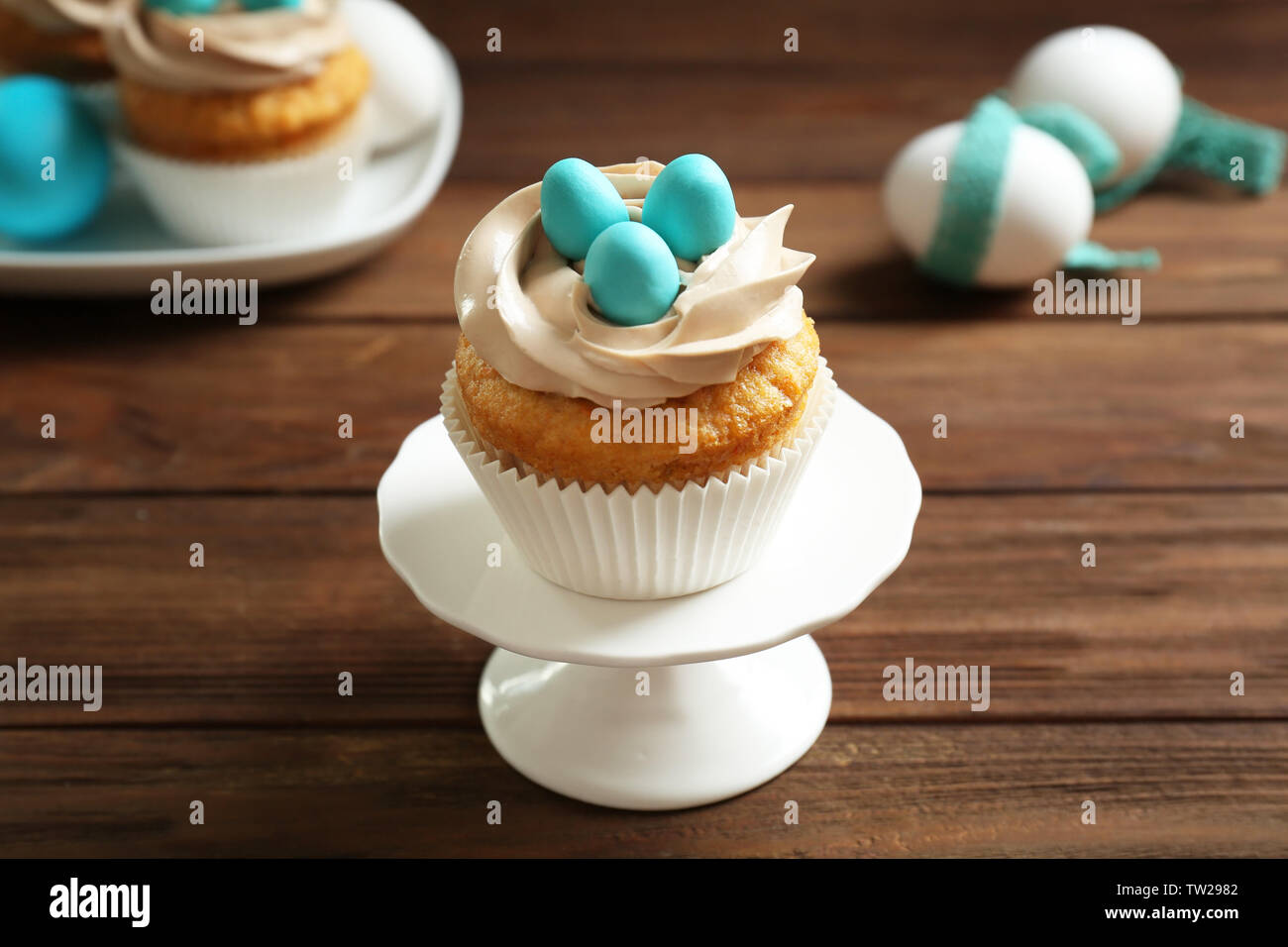 Delicious Easter cupcake on cake stand Stock Photo