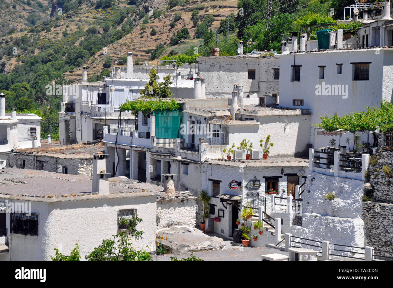 Houses built into the hillside in the picturesque mountain village
