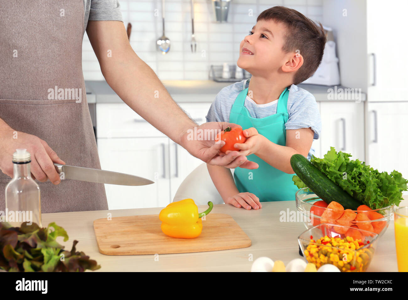 Father and son cooking together in kitchen Stock Photo - Alamy