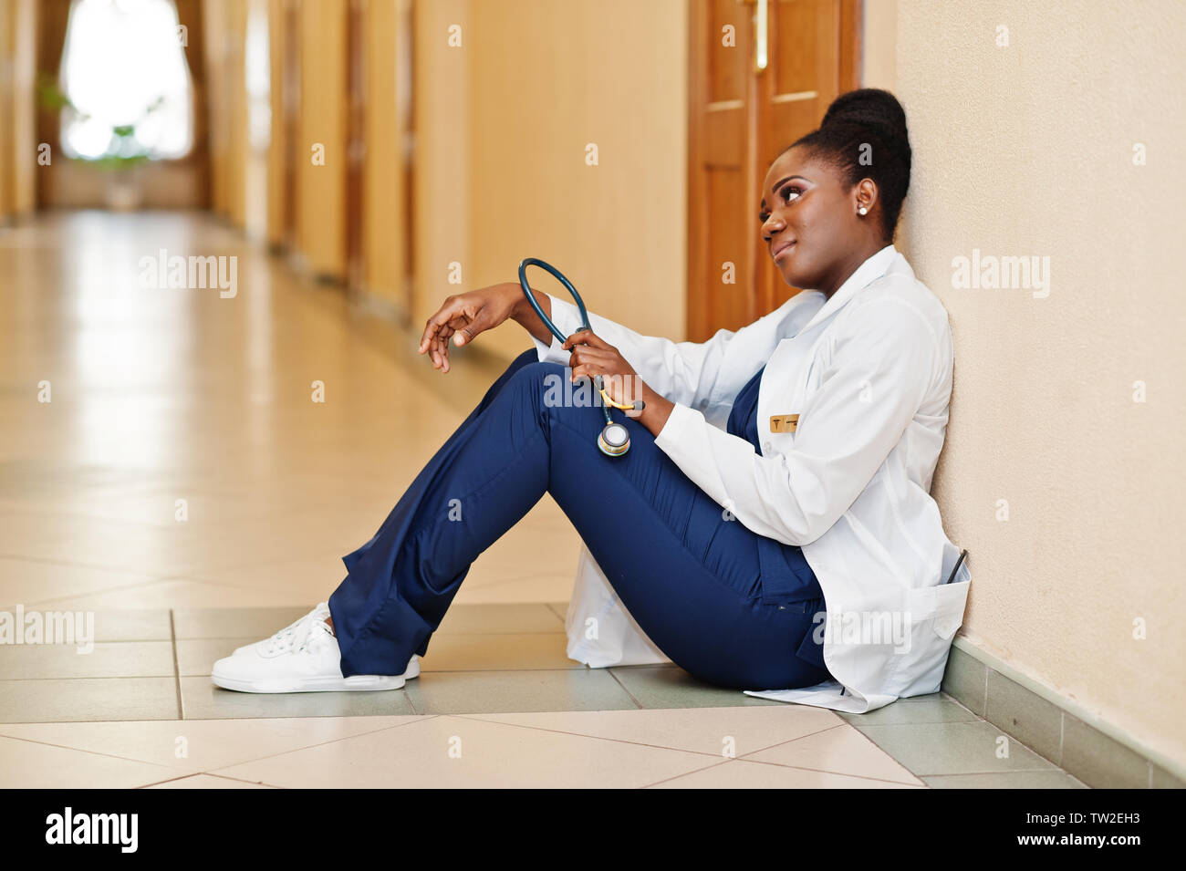 Professional african female doctor at the hospital. Medical healthcare business and doctor service of Africa. Tired after hard work. Stock Photo