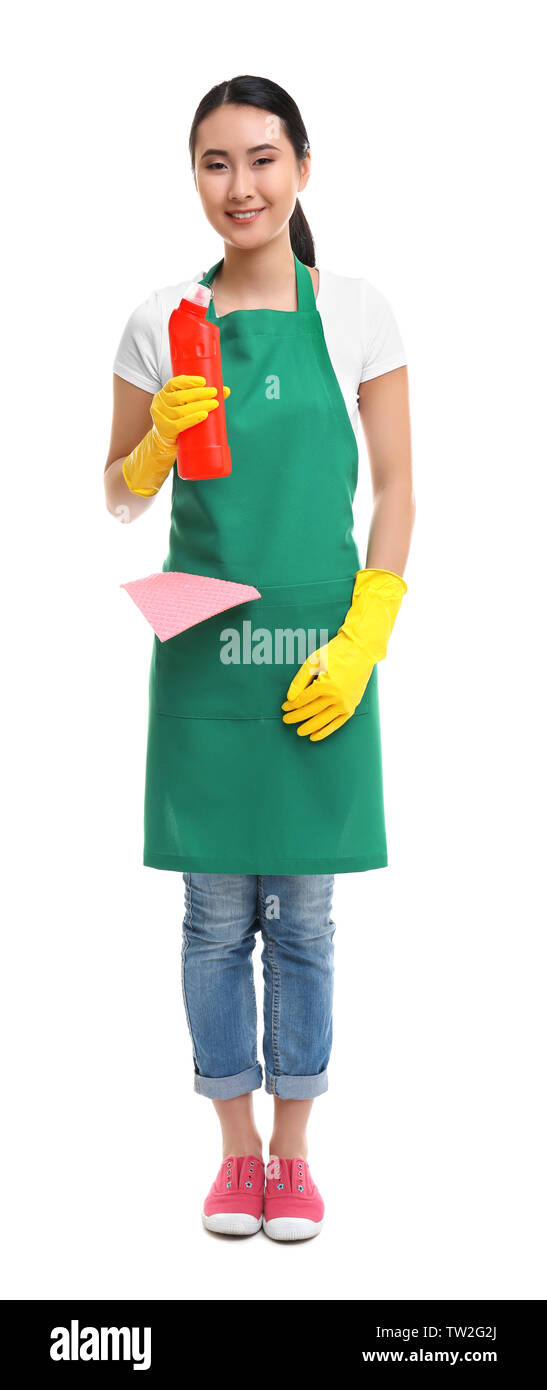 Cleaning concept. Young woman in green apron holding cleanser on white ...