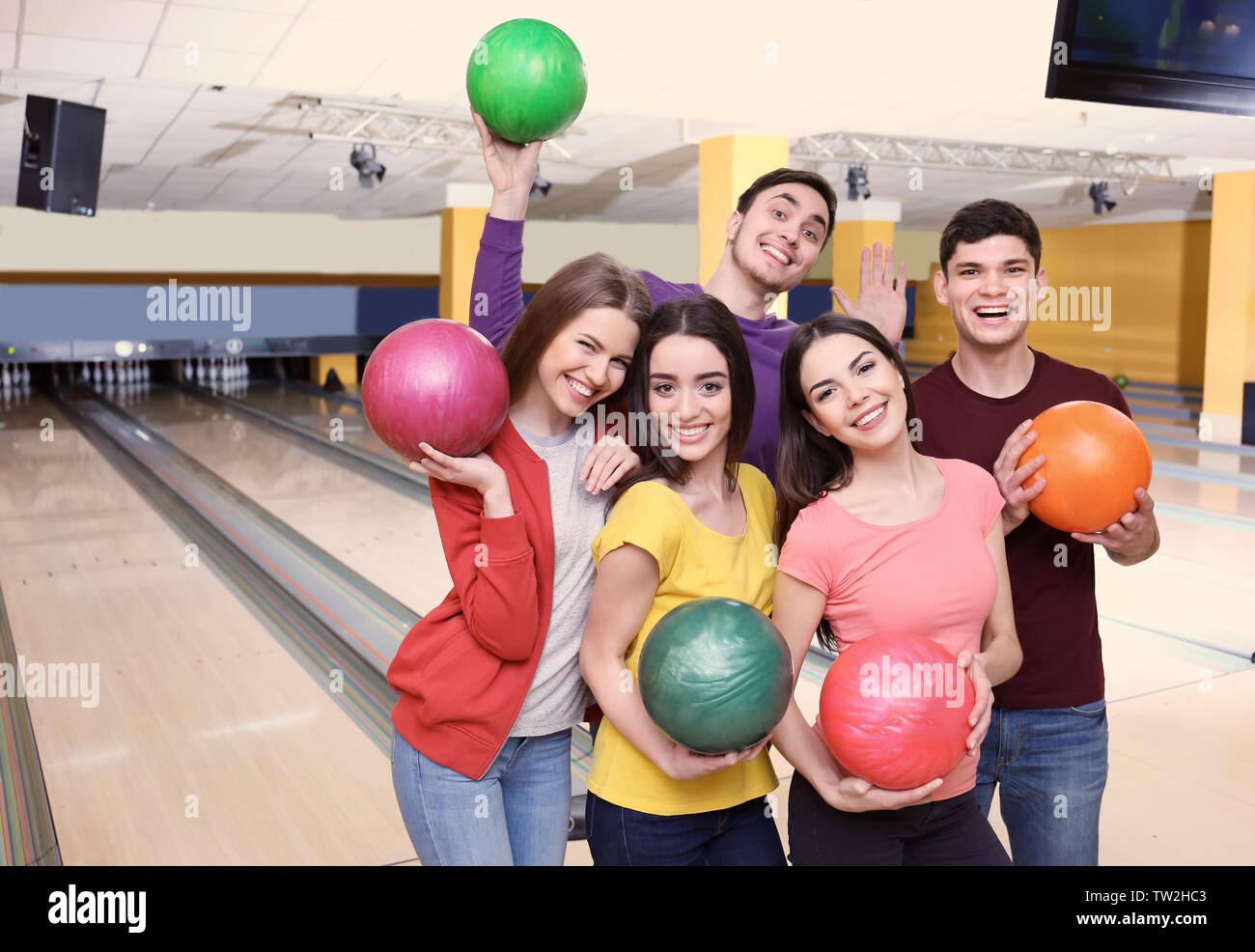 Friends having fun at bowling club Stock Photo