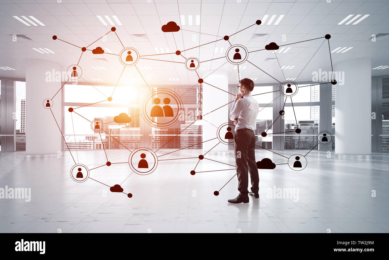 Elegant businessman in 3D office interior and social connection concept ...