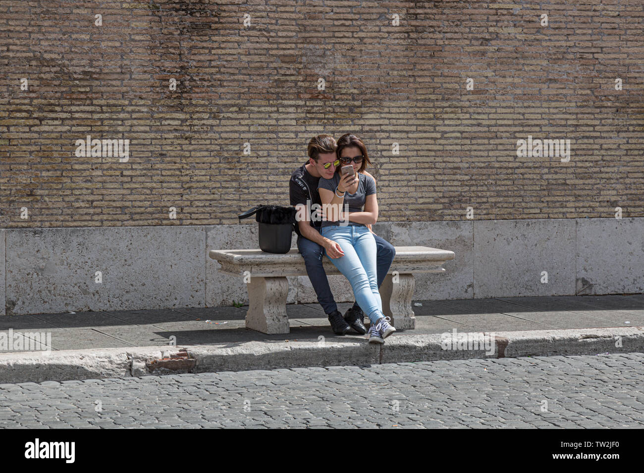 A young couple enjoying themselves in Rome Stock Photo