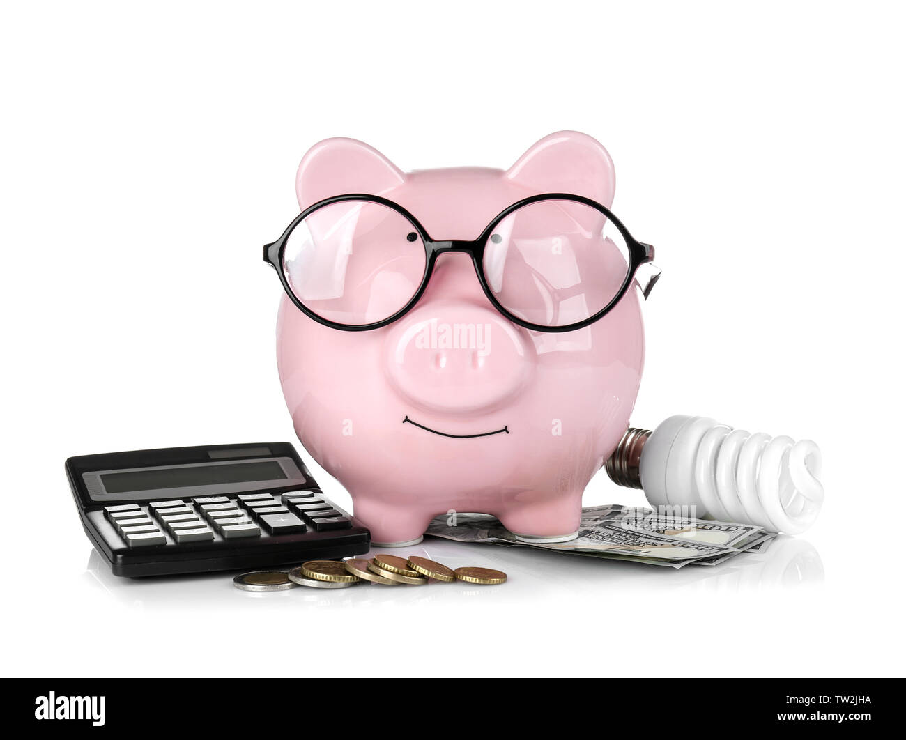 Cute pink piggy bank with glasses, money and bulb on white background ...