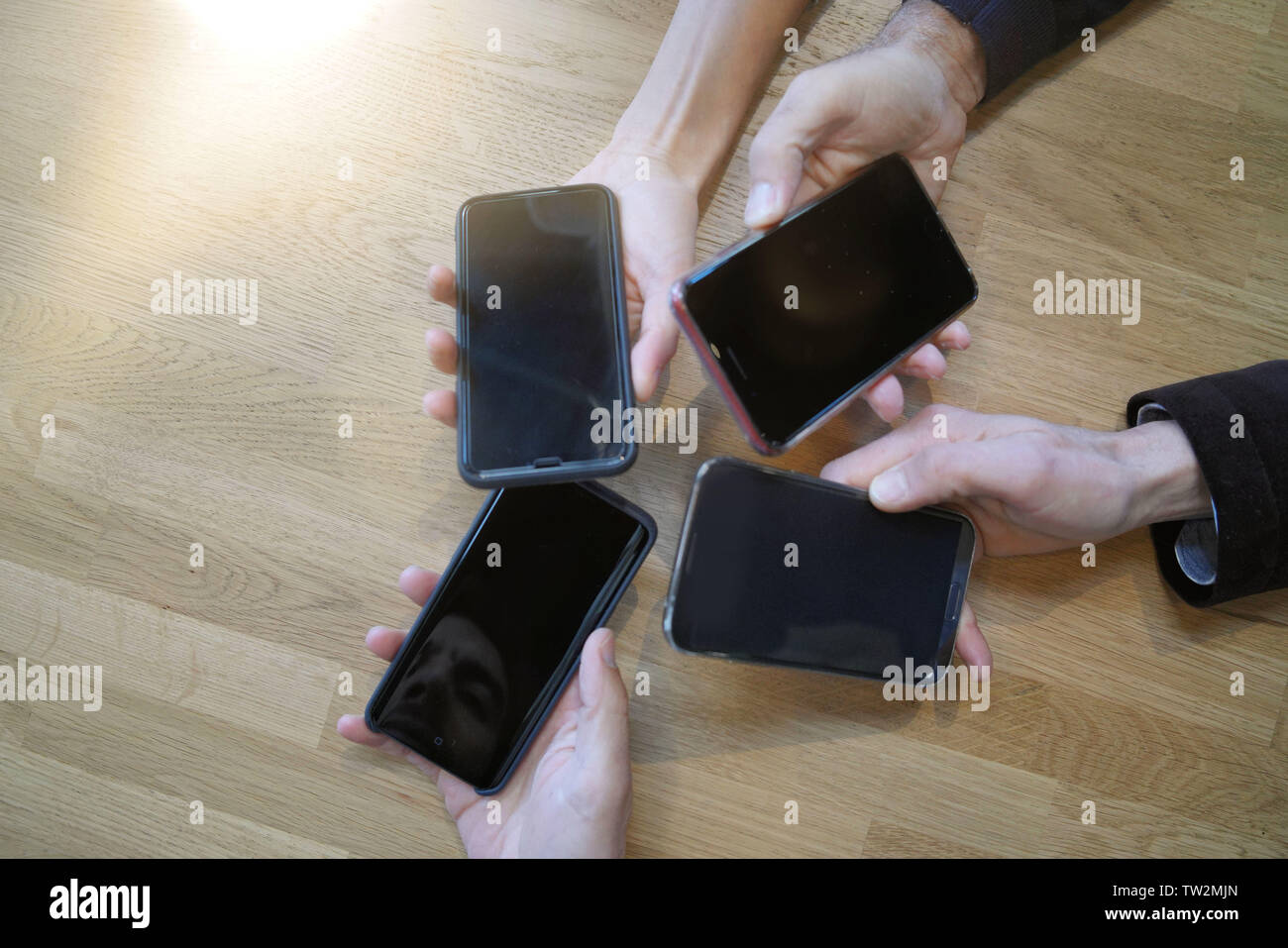 Cellphones hands up hi-res stock photography and images - Alamy
