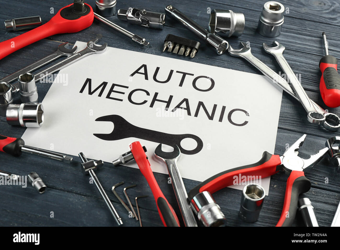 Paper with AUTO MECHANIC text and tools on wooden table Stock Photo - Alamy