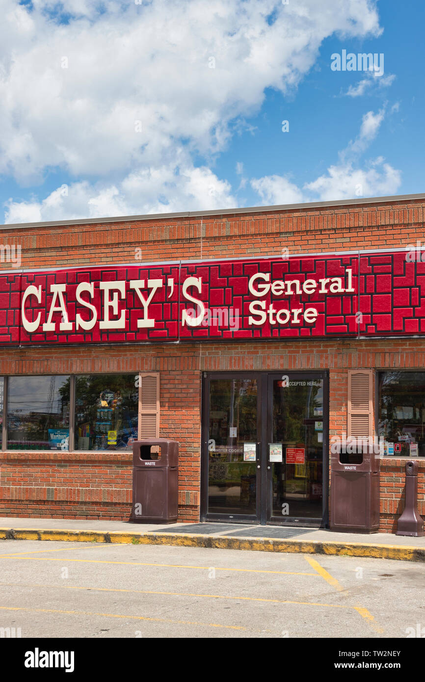 Storefront sign with some sky and clouds. June 2019. Southern Indiana